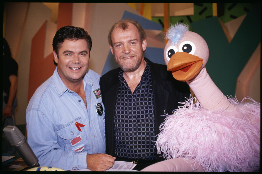 Daryl Somers with English rock singer Joe Cocker and Ossie Ostrich on the set of Hey Hey its Saturday