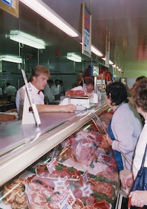 Customers at the meat counter at the Coles Oakleigh New World Supermarket Store No. 645