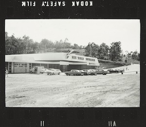 New World Supermarket, exterior, model rocket on corner beside signage, opening day Coles Kenmore Store No. 461